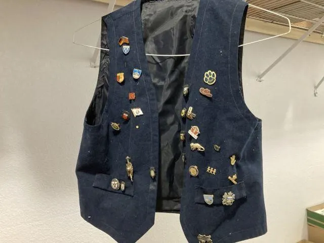 SMALL VEST WITH COLLECTION OF ENAMEL PINS