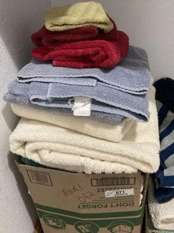 2 BOXES OF ASSORTED TOWELS AND THROW RUGS