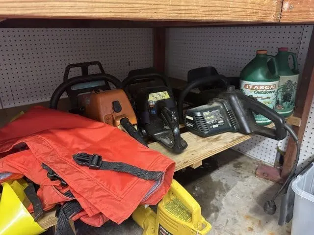 CONTENTS OF SHELF: 3 PORTABLE CHAINSAWS & CHAIN