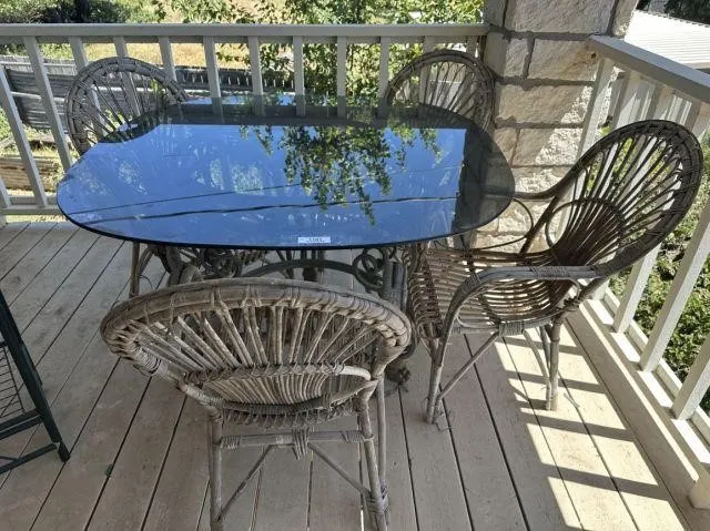 PATIO DINING TABLE WITH GLASS TOP AND 4 RATTAN
