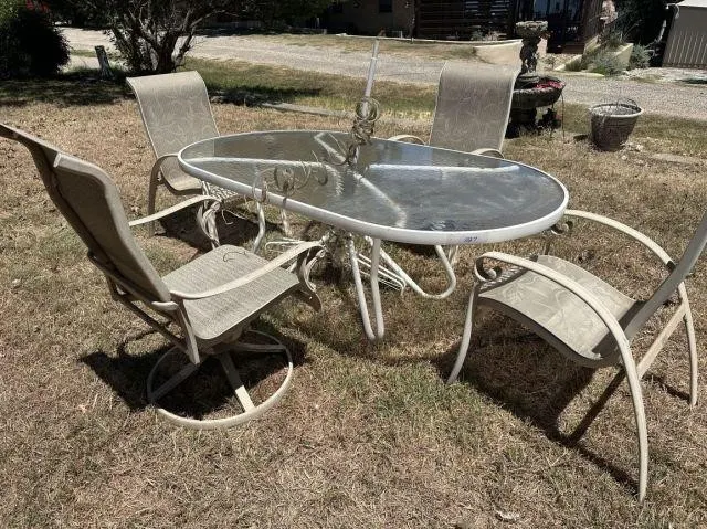 METAL PATIO TABLE WITH A GLASS TOP & 4 CHAIRS