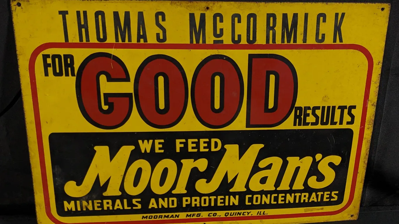 TIN SIGN WE FEED MOOR MANS MOORMANS THOMAS MCCORMICK