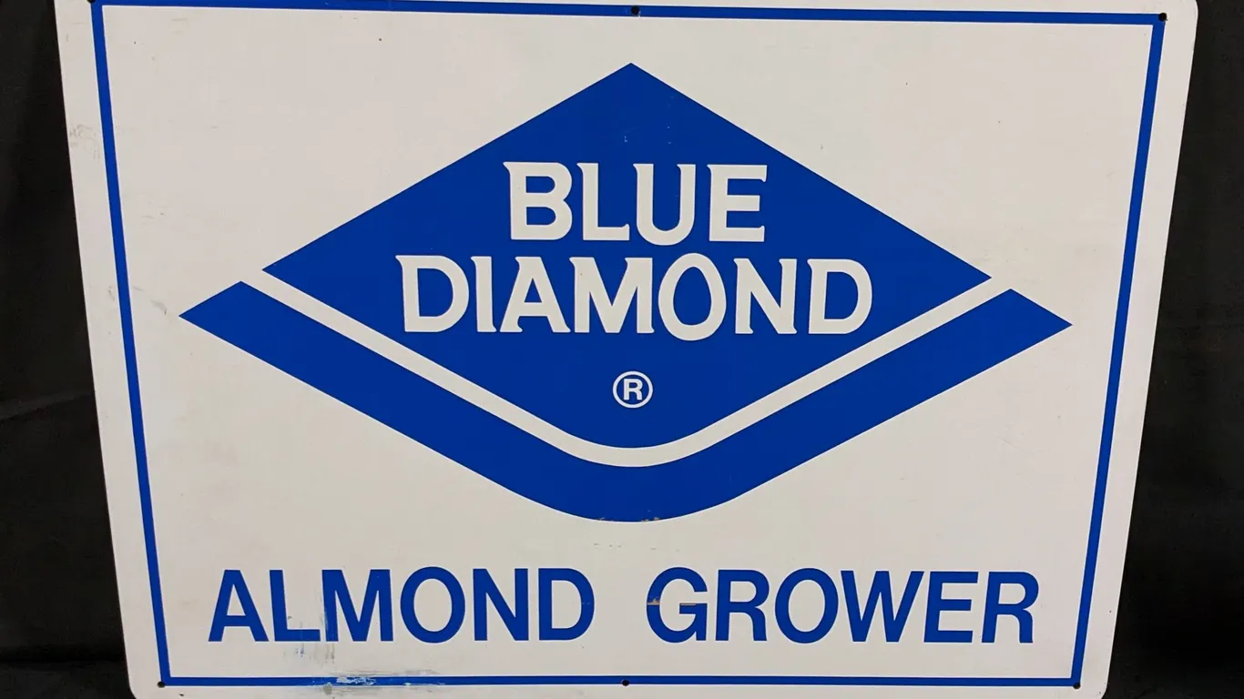 ALUMINUM SIGN BLUE DIAMOND ALMOND GROWER