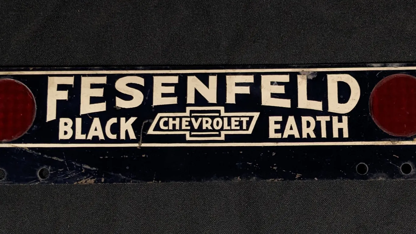 TIN LICENSE PLATE TOPPER SIGN FESENFELD CHEVROLET BLACK EARTH (WISCONSIN)