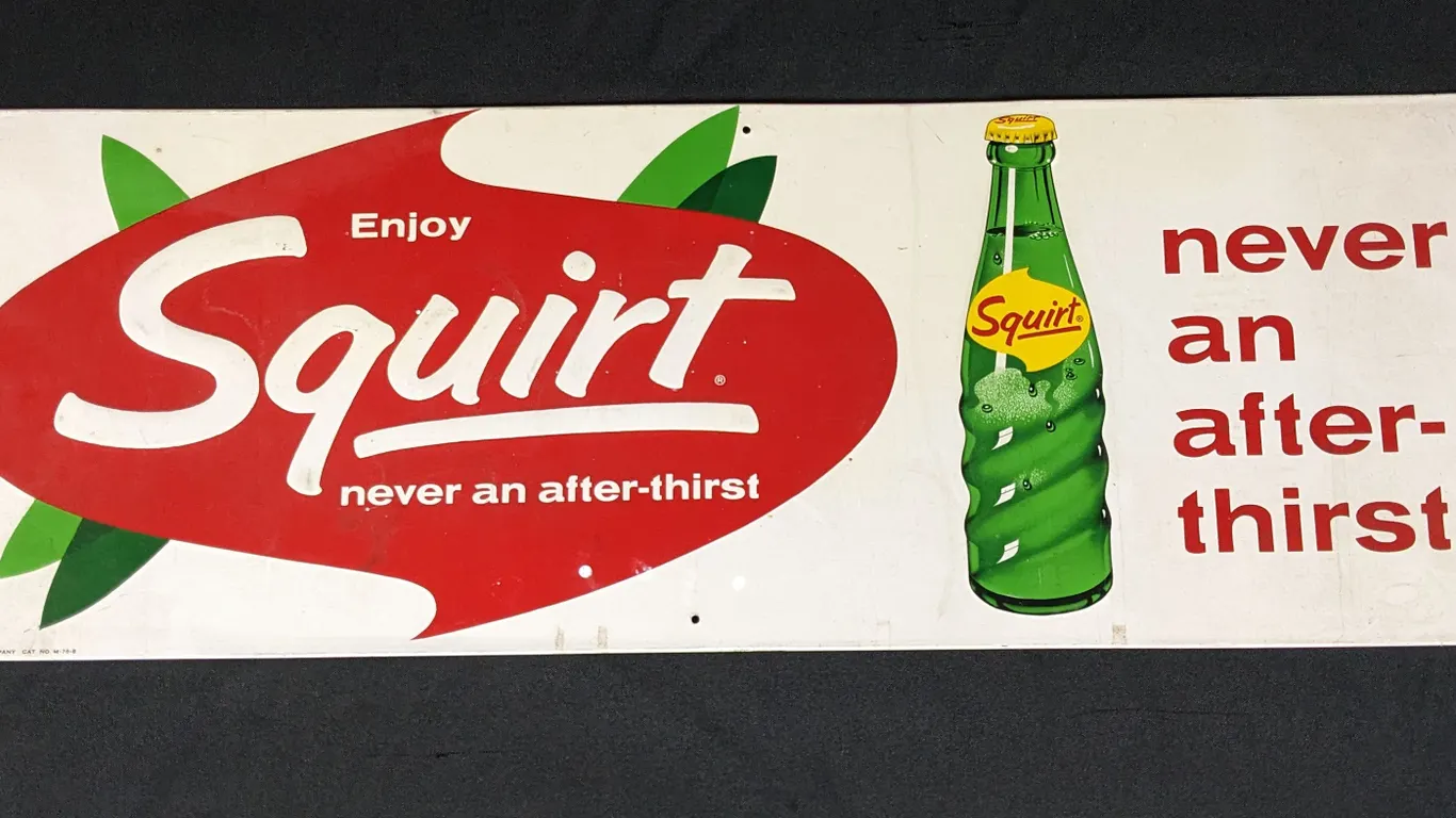 EMBOSSED TIN SIGN ENJOY SQUIRT NEVER AN AFTER THIRST