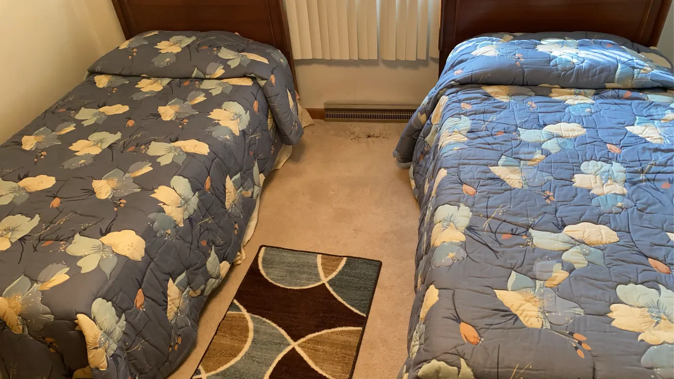 Pair of Twin Beds with Matching Floral Bedding