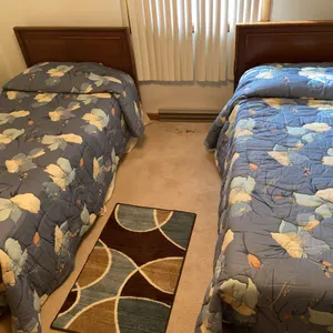 Pair of Twin Beds with Matching Floral Bedding