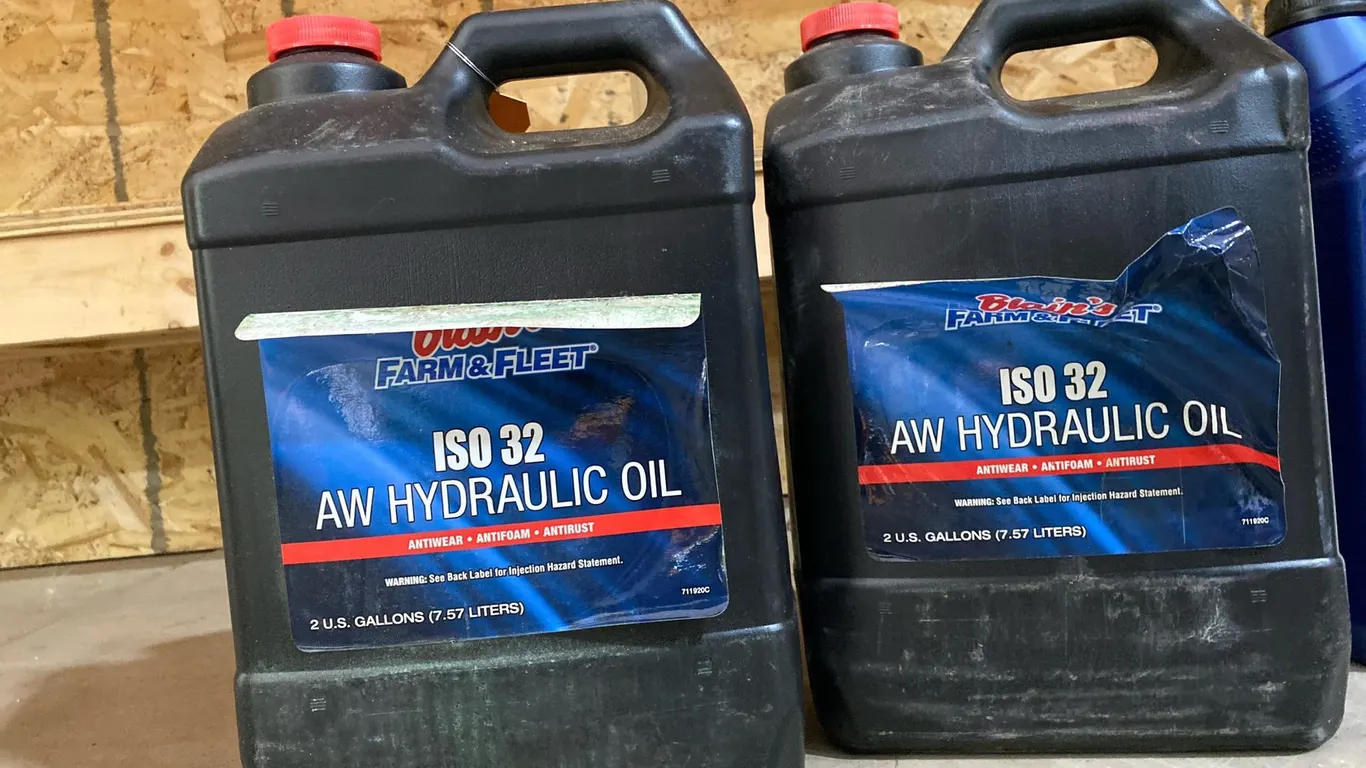 (2) Hydraulic Oil Jugs
