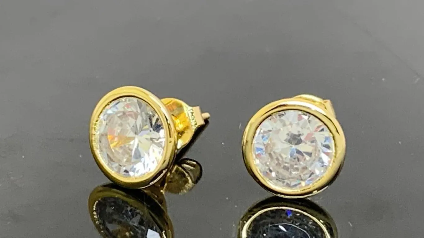 Gold Tone Stud Earrings With Clear Stones