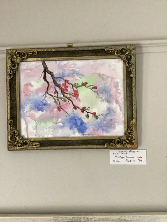 Watercolour painting titled "Cherry Blossoms" featuring a branch with blooms against a pastel backgr