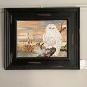  original painting by Marie Sveinson.featuring a snowy owl perched on a branch with a landscape back
