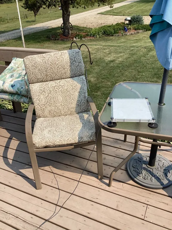 Four Outdoor Patio Chairs with Cushions and Glass Patio Table with Umbrella