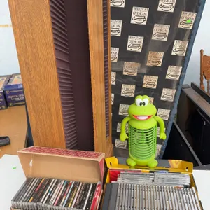 Over 70 Rock and Pop CDs with Green Frog CD Holder