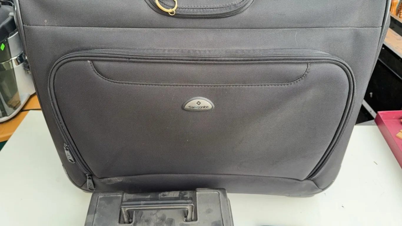 Samsonite Rolling Suitcase With Montreal Canadiens Wallet and Plastic Case