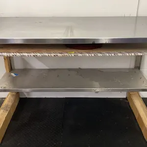 STAINLESS STEEL COMMERCIAL PREPARATION TABLE ON WOODEN BLOCKS APPROX 60"L X 30"D X 40"H