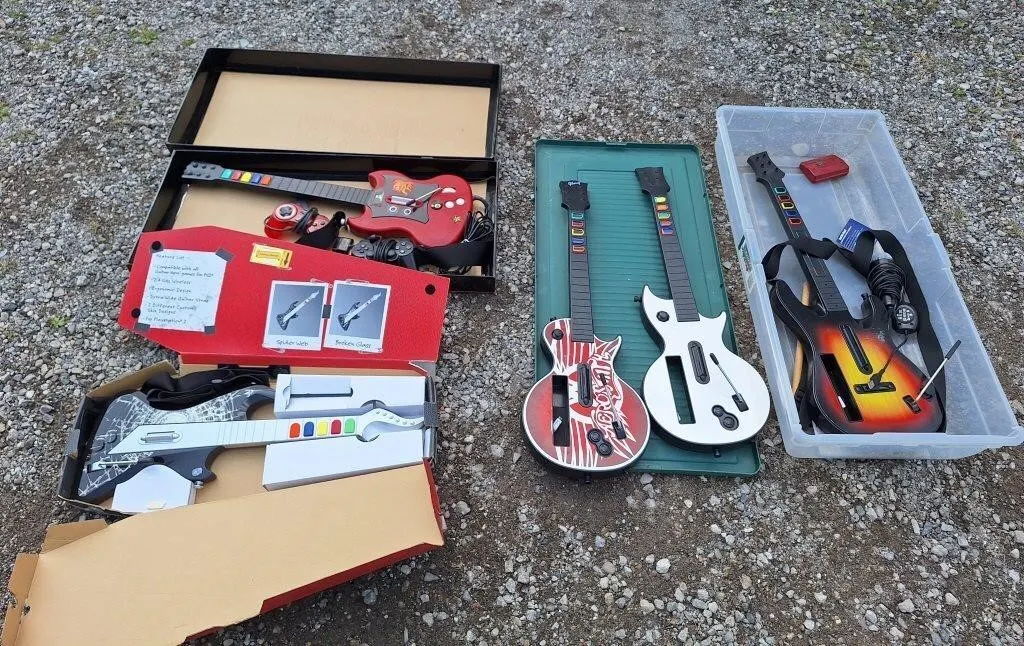 3 wii guitars and 2 Playstation 2 guitars