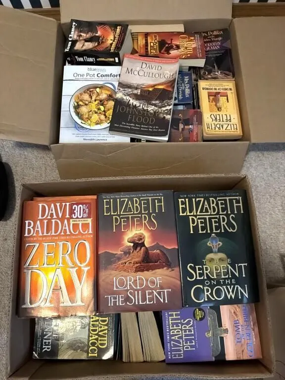 Cookbooks, Novels, and More
- (2) boxes of books