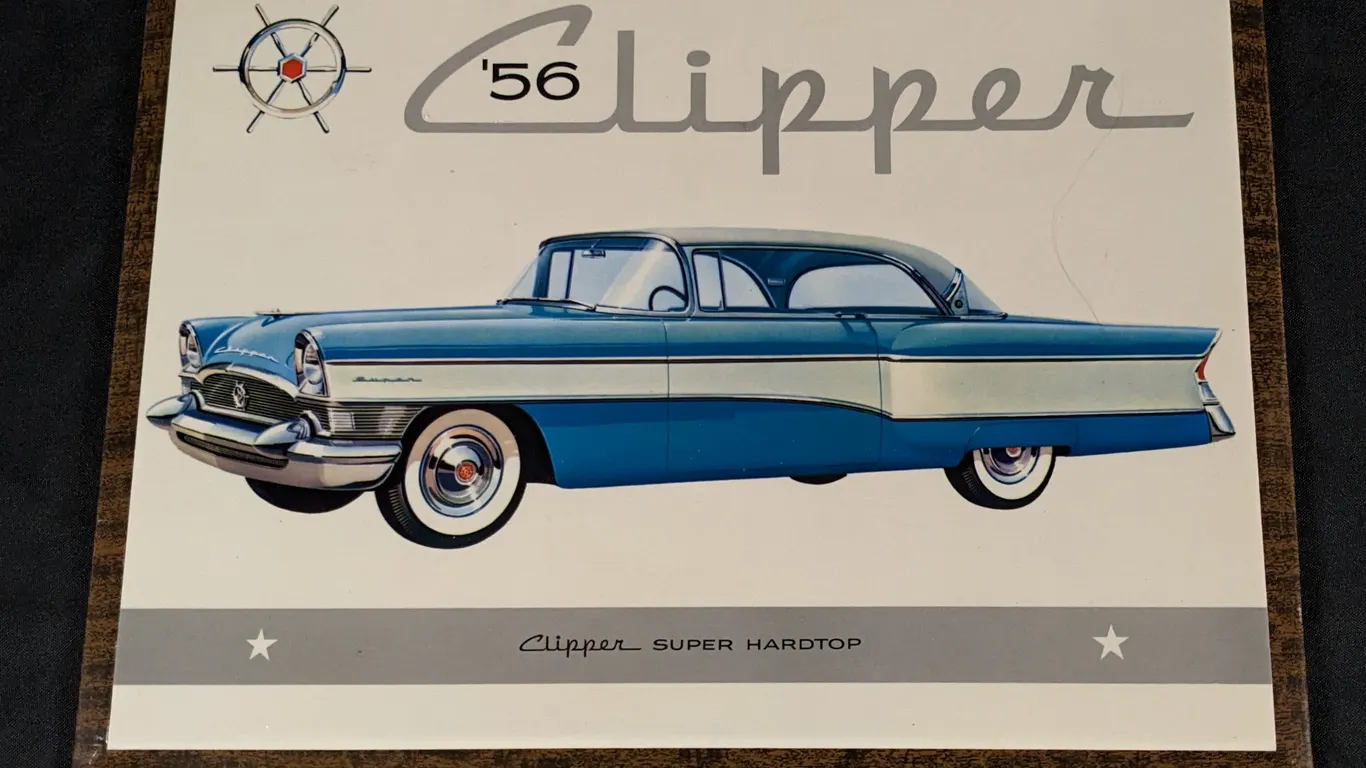 CELLULOID OVER TIN SIGN 1956 PACKARD CLIPPER SUPER HARDTOP