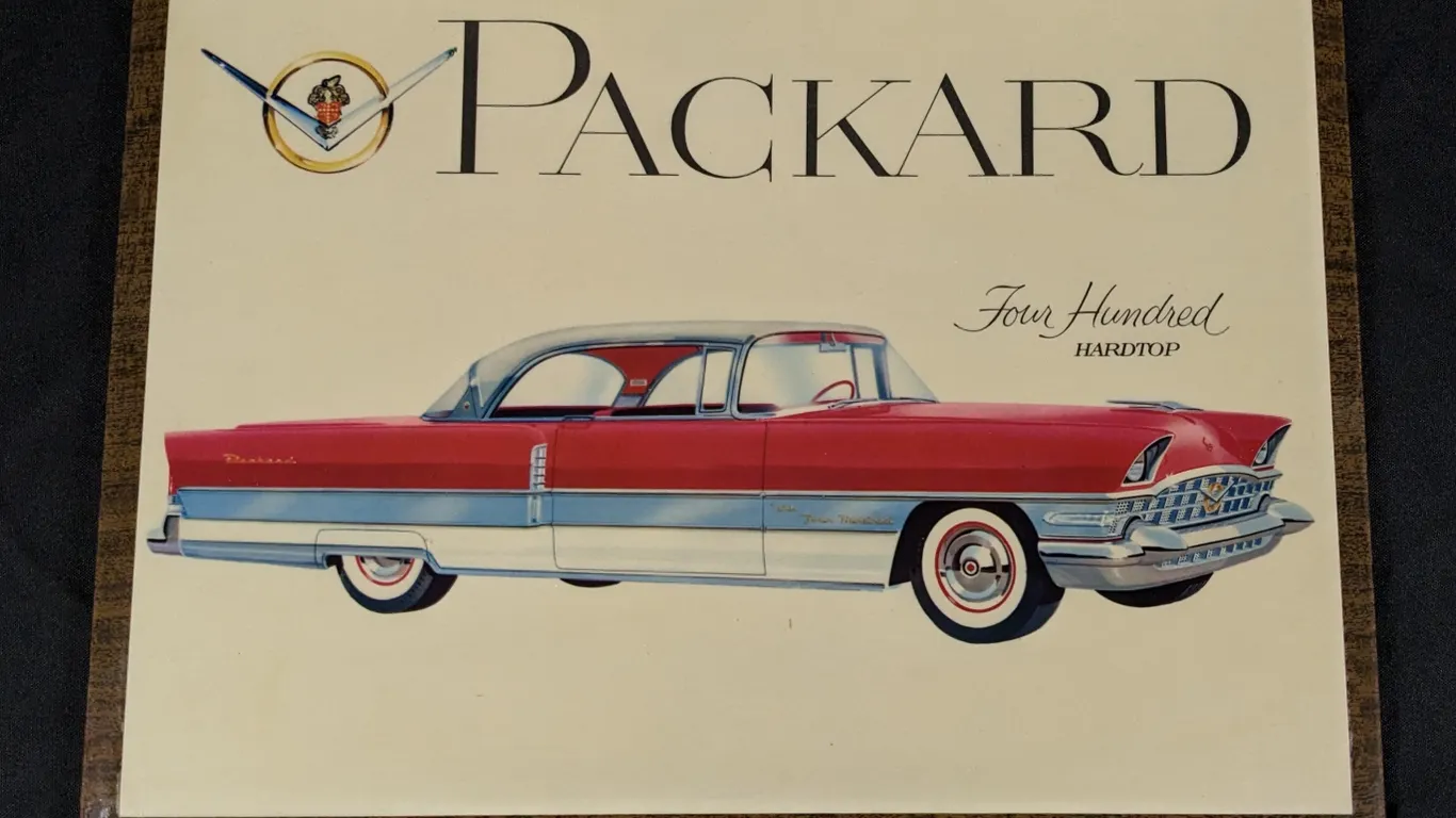 CELULOID OVER TIN SIGN PACKARD FOUR HUNDRED HARDTOP