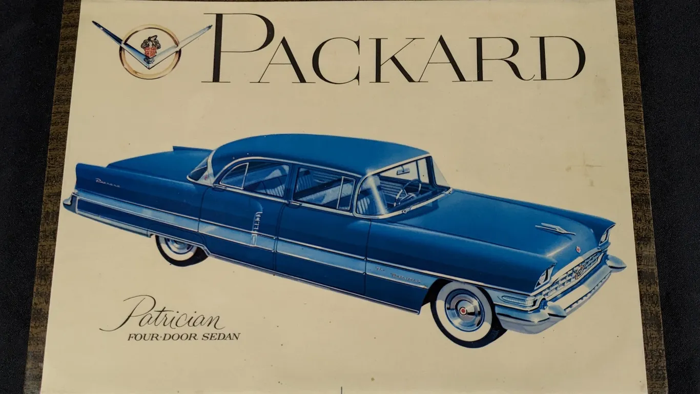 CELLULOID OVER TIN SIGN PACKARD PATRICIAN FOUR DOOR SEDAN