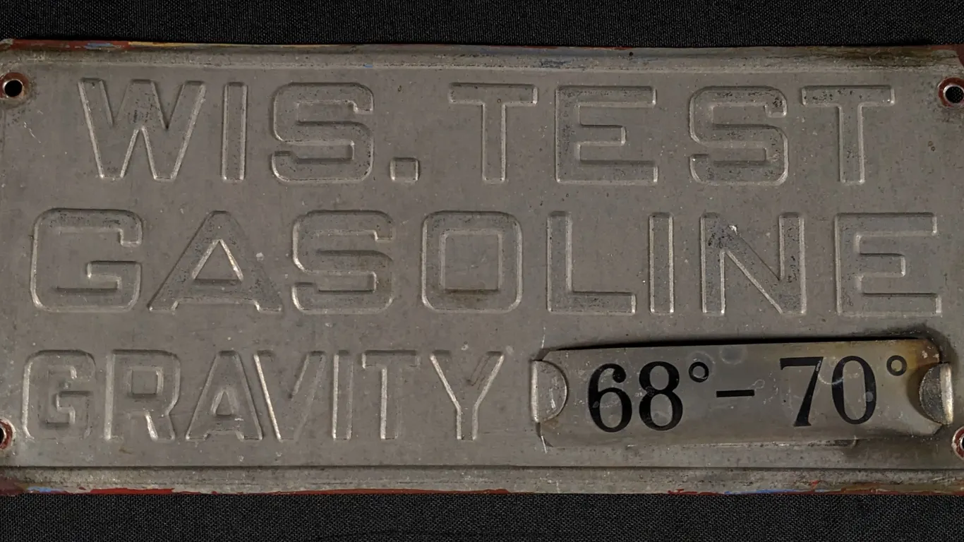 EMBOSSED ALUMINUM VISIBLE GAS PUMP SIGN WIS. TEST GASOLINE
