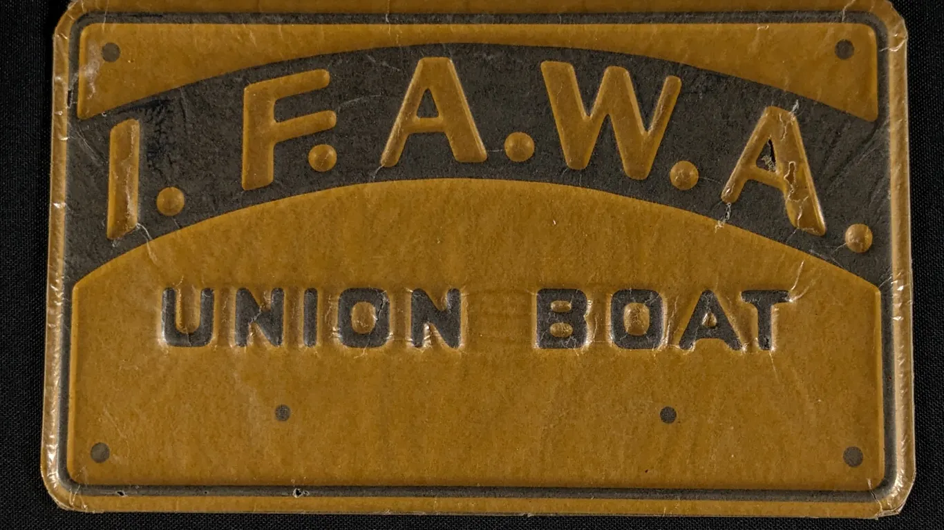 NOS EMBOSSED TIN SIGN I.F.A.W.A. UNION BOAT