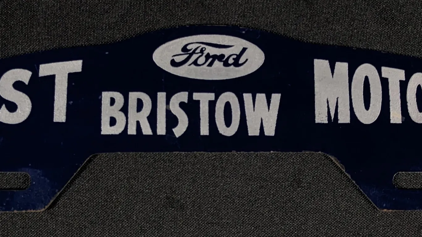 TIN LICENSE PLATE TOPPER SIGN LIST MOTORS FORD BRISTOW OKLAHOMA