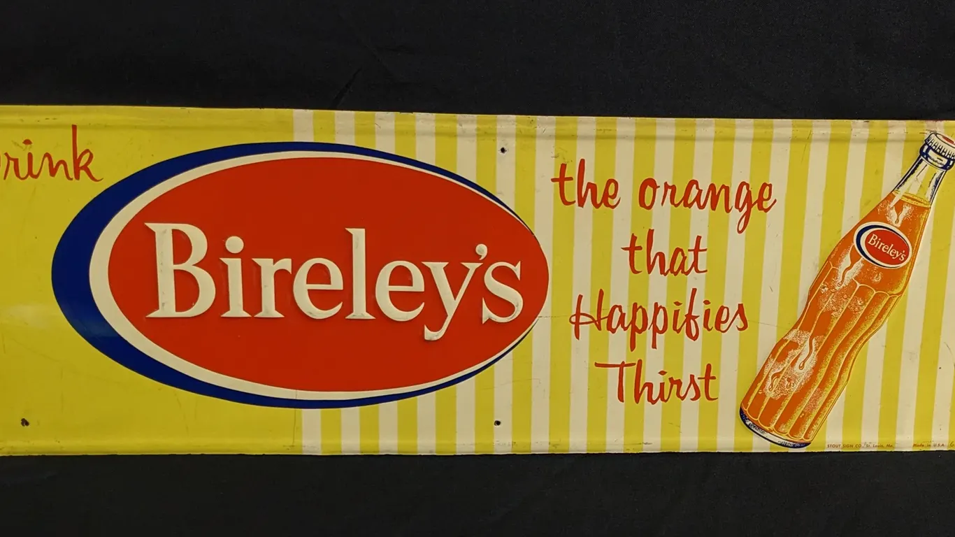 EMBOSSED TIN SIGN DRINK BIRELEY'S THE ORANGE THAT HAPPIFIES THIRST