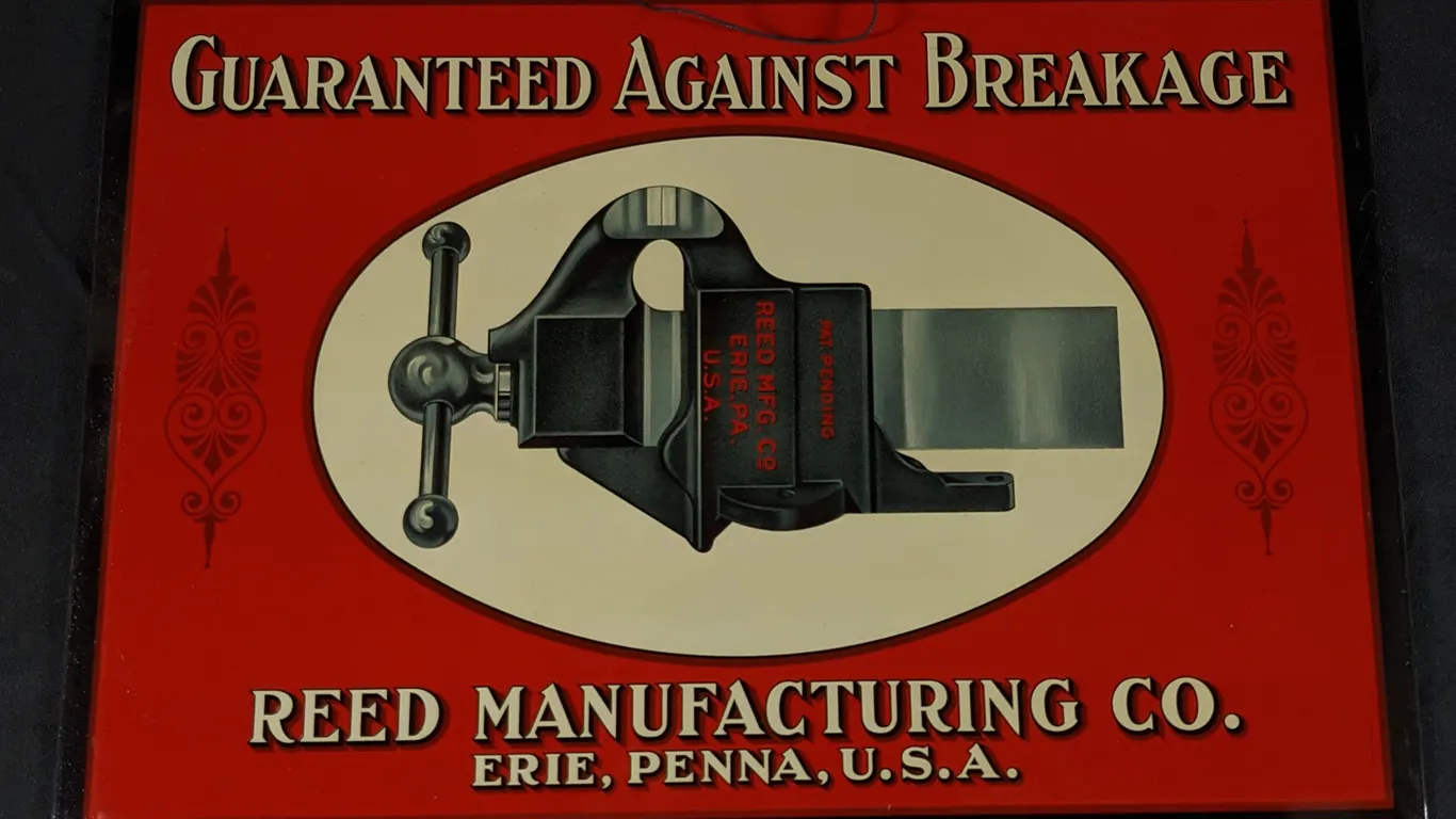 NOS TIN SIGN GUARANTEED AGAINT BREAKAGE REED MANUFACTURING ERIE PENNSYLVANIA (BENCH VISE)