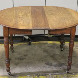 Wood Dining Table with Turned Legs and Casters