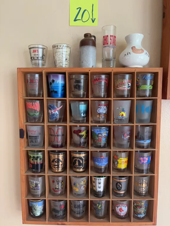 39 Shot Glasses with Wooden Display Rack, Stoneware Jug, and Ceramic Vase