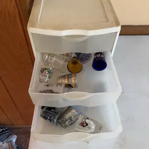 Sterilite 3-Drawer Storage Cabinet with Assorted Souvenir Glasses and Mugs