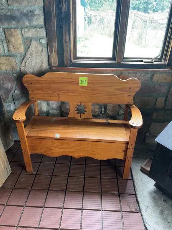 Wooden Storage Bench with Southwestern-Style Cutout and Winter Gear Contents