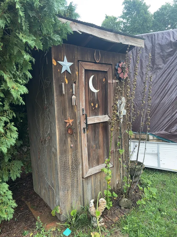 Decorative Outhouse Styled Storage Shed