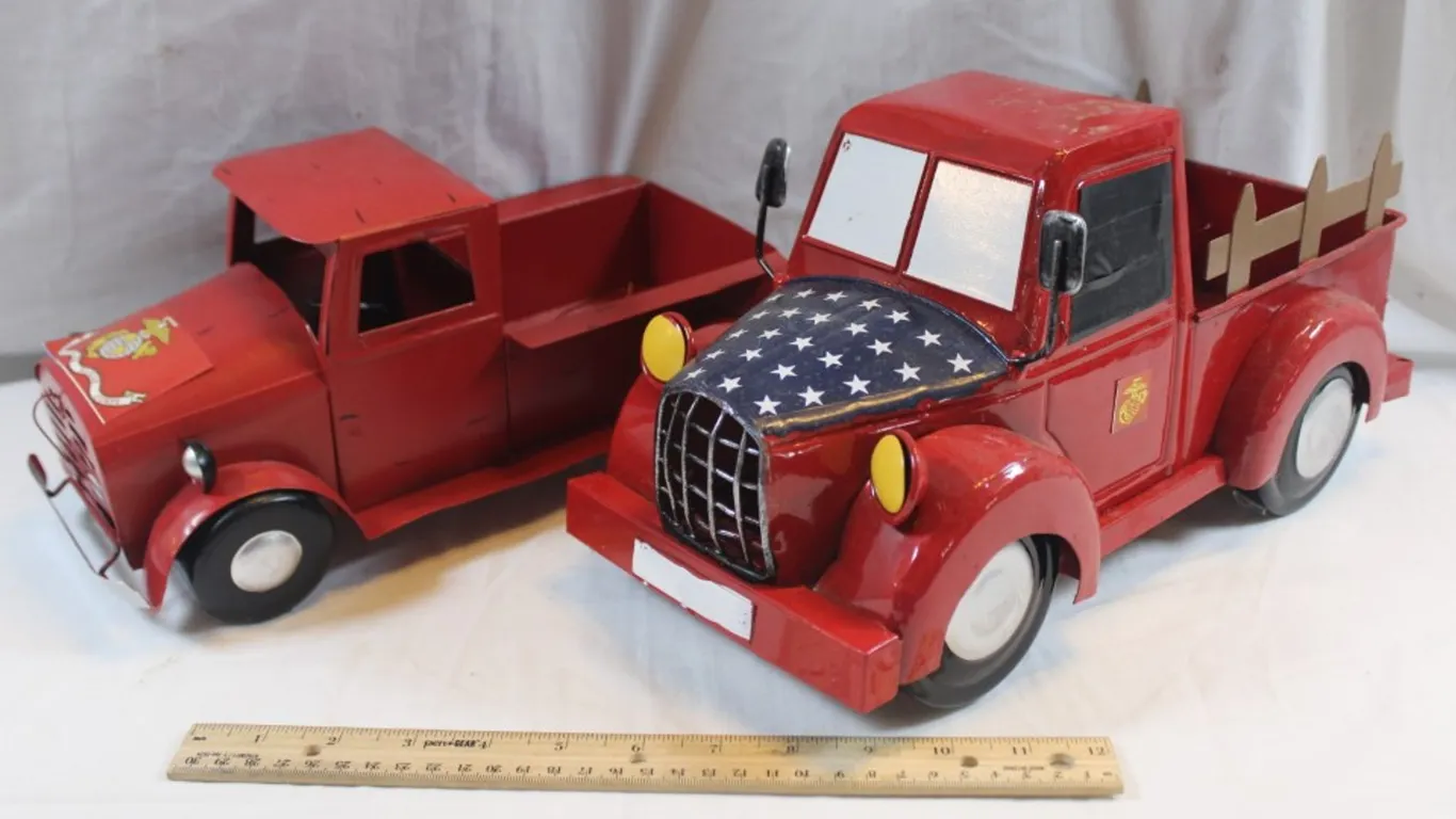 Two Tin Marine Themed Trucks