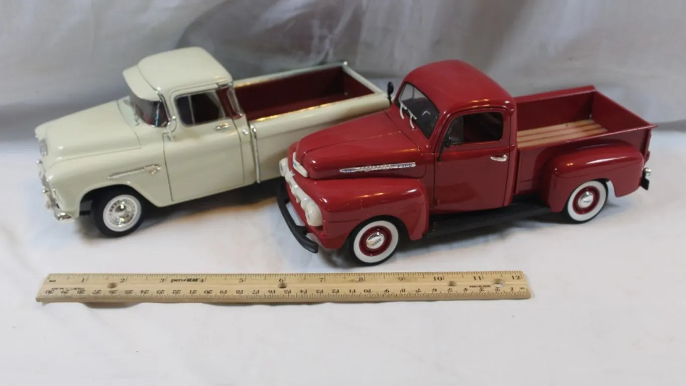 Two 1:18 Scale Diecast Trucks: 1955 Chevy Pickup Missing a Wheel and 1951 Ford