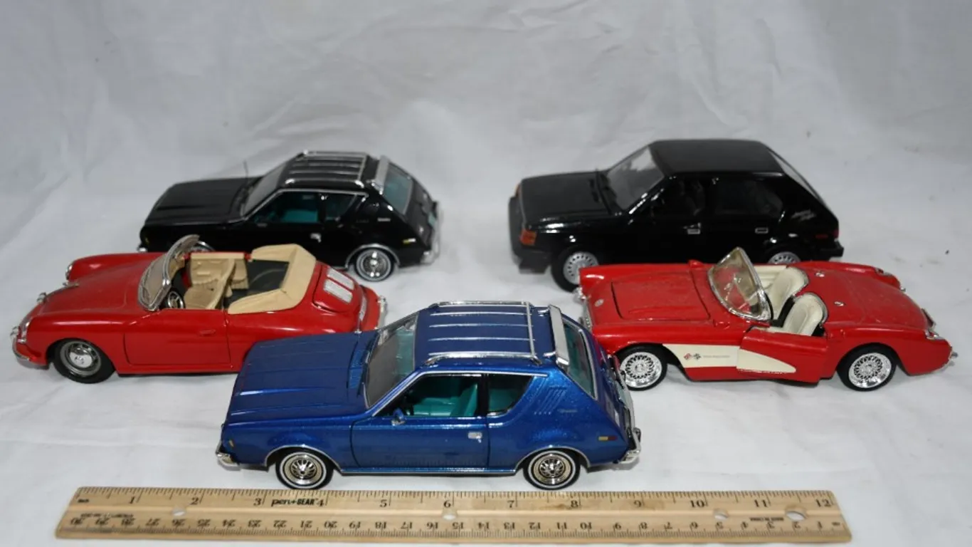 Five 1:24 Scale Diecast Models: 1957 Chevy Corvette, Porsche 935, E85 Dodge Omni American Graffiti Edition,