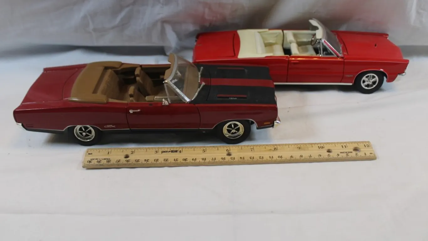 Two 1:18 Scale Diecast Models, Maisto 1965 Pontiac GTO and Ertl 1969 Plymouth GTX