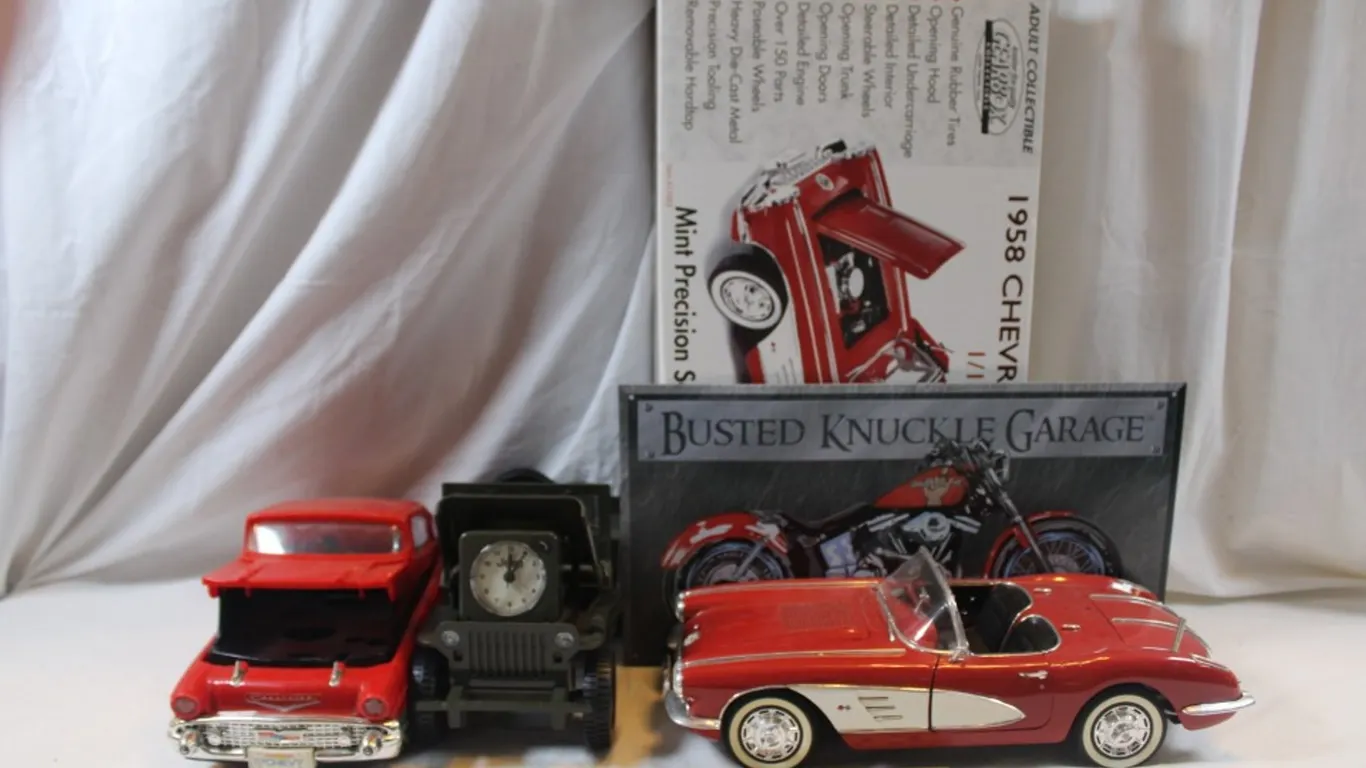 3 Model Cars and a Tin Motorcycle Sign to Include Diecast 1:12 Scale 1958 Corvette Plastic 57 Chevy VHS Rewinder with No Cord and a Military Jeep Cloc