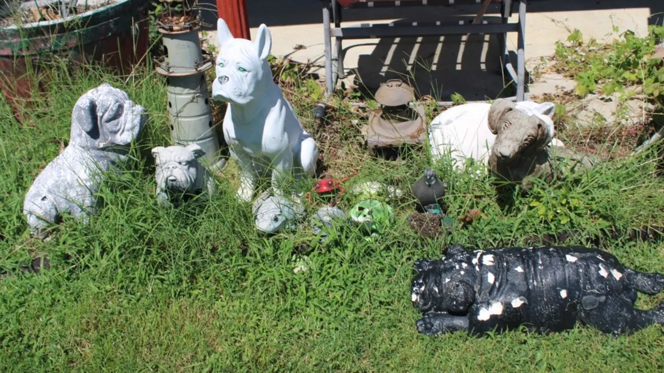 Dotson Concrete Dog, Plastic Dogs and Animals, Dry Rotted Rocking Chair, and Lantern Holder