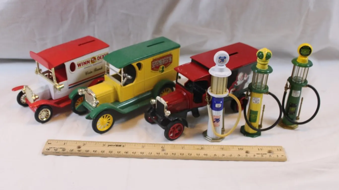 Three 1:24 Scale Cast Iron Banks and Miniature Gas Pumps: Winn-Dixie Golden, Coca-Cola September Fest '96 Ertl 1923 Delivery Van, and Coca-Cola Ertl K