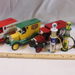 Three 1:24 Scale Cast Iron Banks and Miniature Gas Pumps: Winn-Dixie Golden, Coca-Cola September Fest '96 Ertl 1923 Delivery Van, and Coca-Cola Ertl K