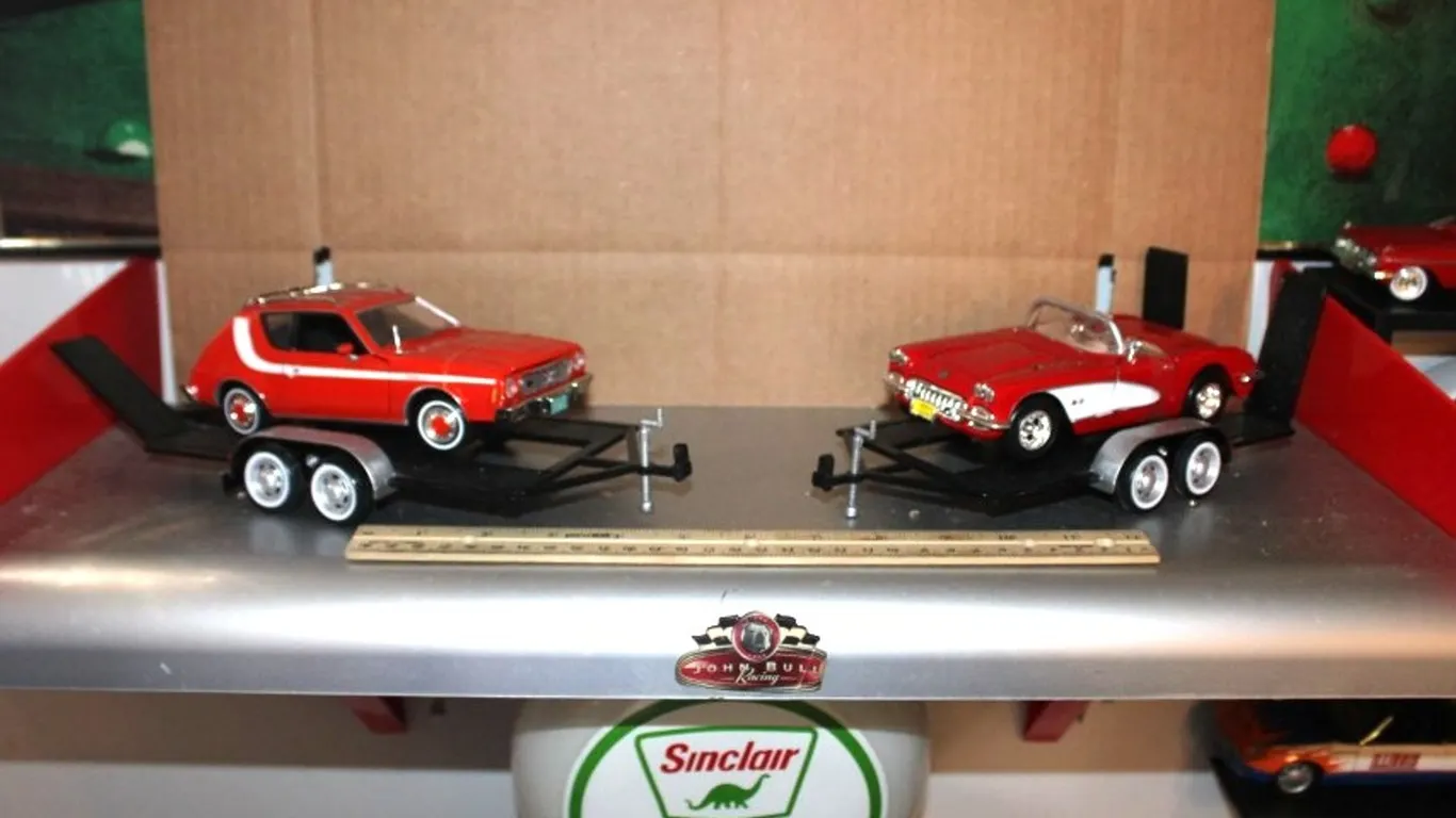 Display Shelf with Two 1:24 Scale Models on Trailers: 1974 AMC Gremlin X and '59 Corvette. Shelf Measures 24 x 11.5 x 11.5