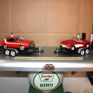 Display Shelf with Two 1:24 Scale Models on Trailers: 1974 AMC Gremlin X and '59 Corvette. Shelf Measures 24 x 11.5 x 11.5