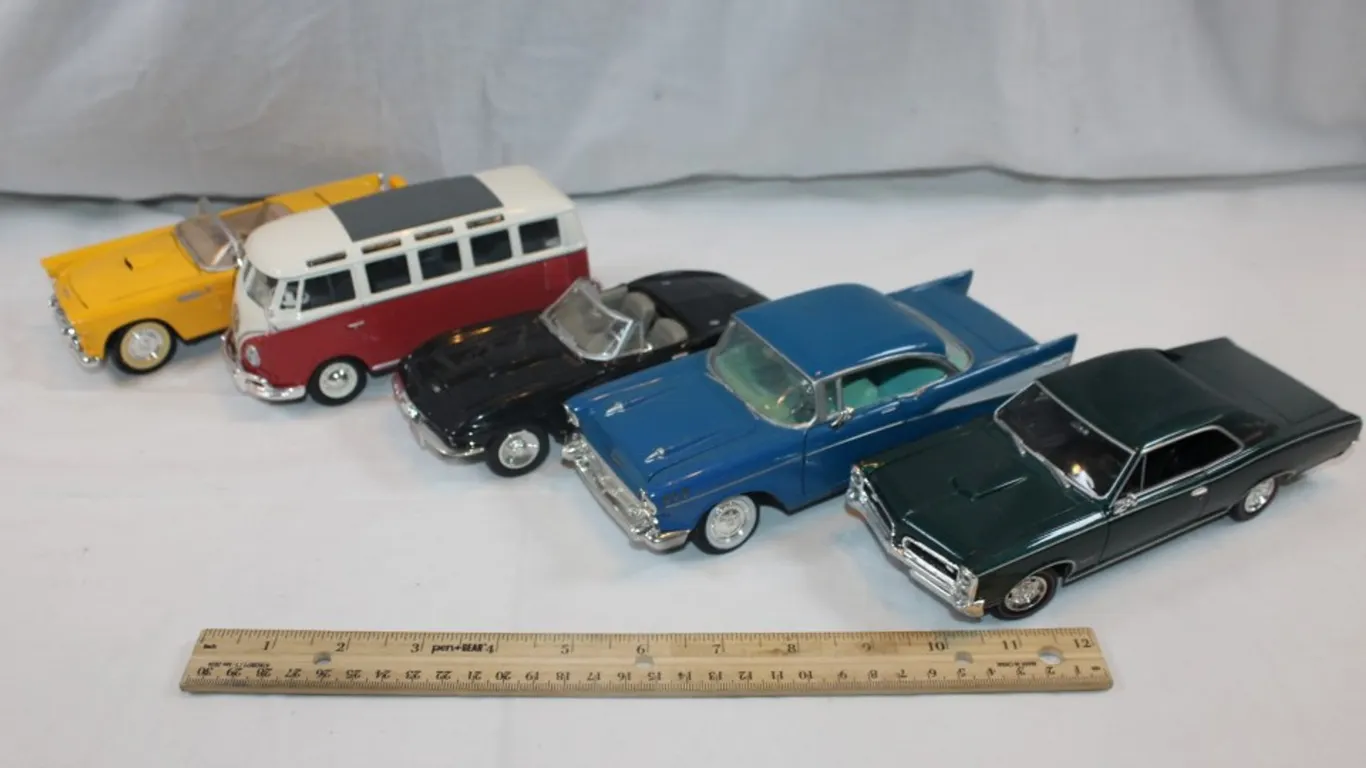 Five 1:24 Scale Diecast Cars: 1957 Chevy Bel Air, Classic Metalworks Pontiac GTO, 1967 Chevy Corvette, Maisto Volkswagen Van, and Ford Thunderbird