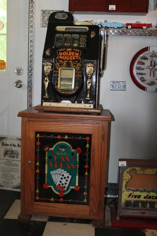 Golden Nugget 25 Cent Slot Machine and Slot Machine Stand Slot Machine Currently Works Machine Measures 16 x 16 x 26 Cabinet Measures 22.5 x 17 x 28 H