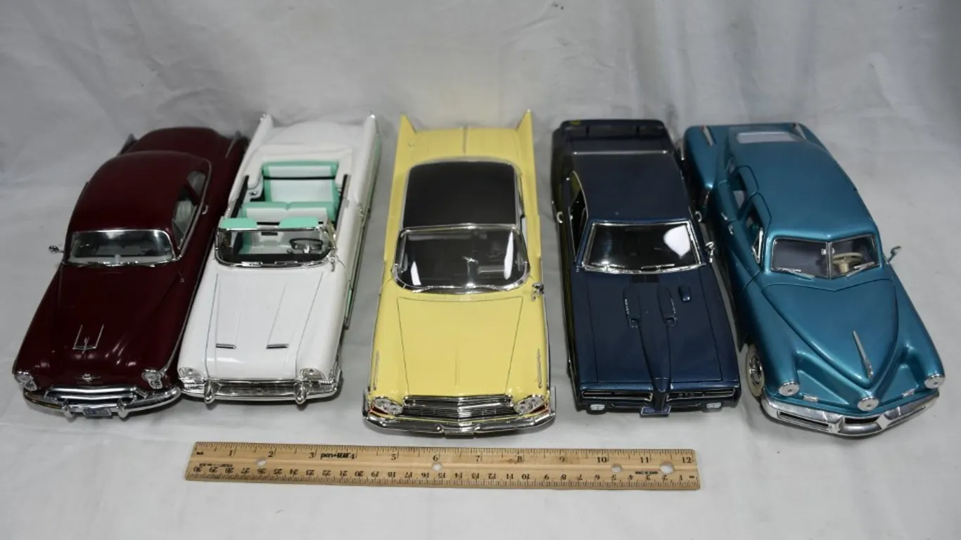 Five 1:18 Scale Diecast Models: 1948 Tucker, 1955 Packard Caribbean, 1961 Chrysler, 1969 Pontiac GTO Judge,