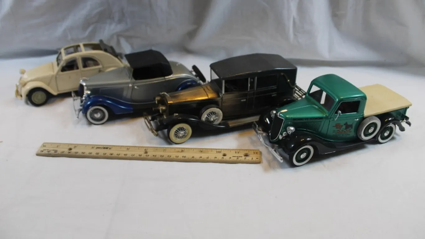Four 1:18 Scale Diecast Models, 1936 Ford V8 Pickup, Maisto Citroen 2 CV, and a Battery Operated '20s Lincoln