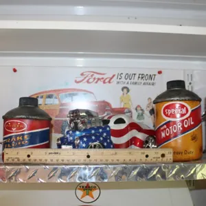 Model Gas Pumps, Oil Can Stash Containers, a Master Mechanic's Willys Coupe Hot Rod, and a Tin Ford Sign
