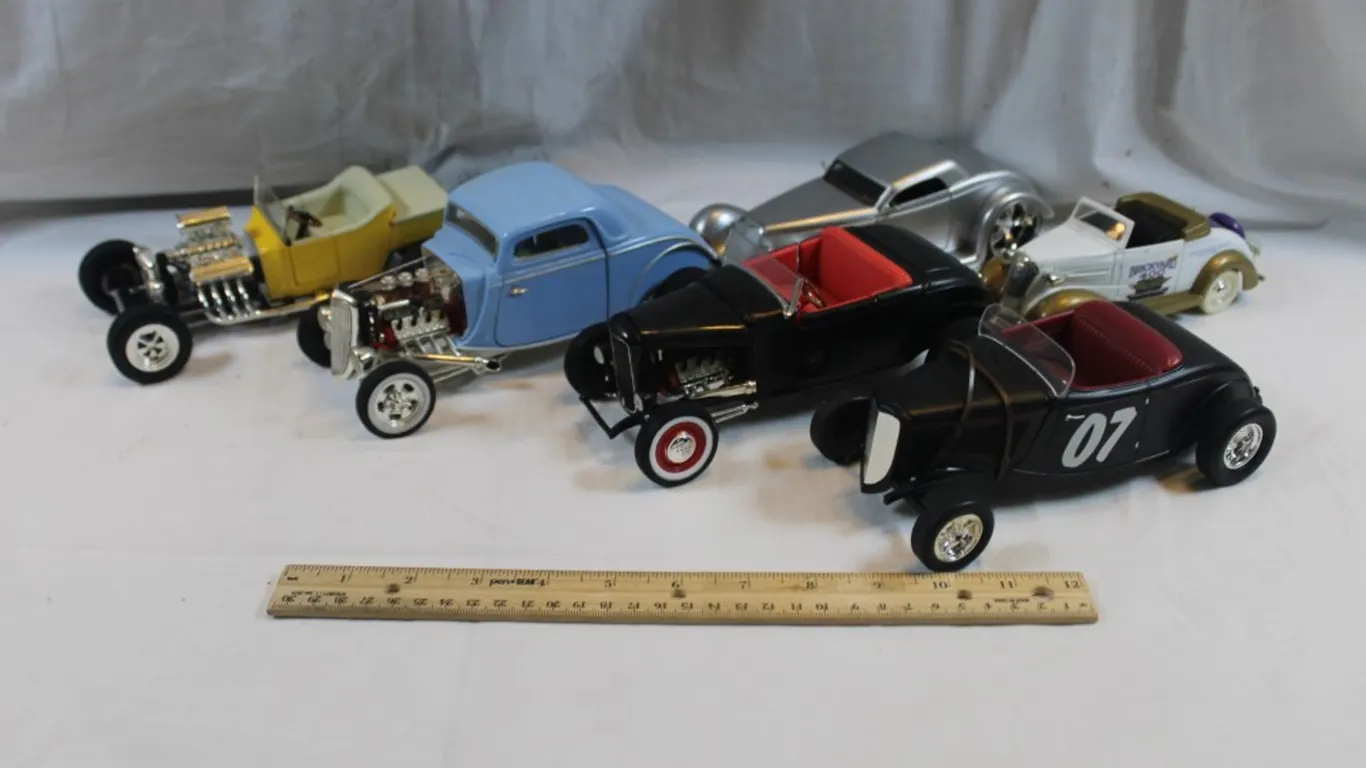 Six Diecast Cars, Three Ertl Ford T-Buckets, Jada 1934 Ford, Racing Champions 33 Ford, and a 34 Chevy Brickyard 400 Coin Bank